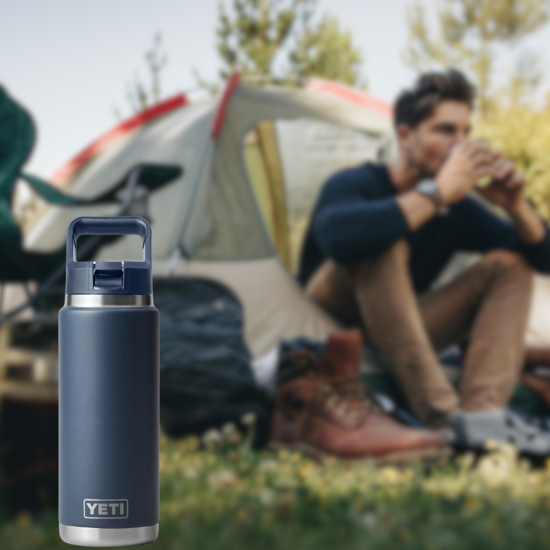 Yeti water bottle containing Access Filter Straw in front of man camping in tent