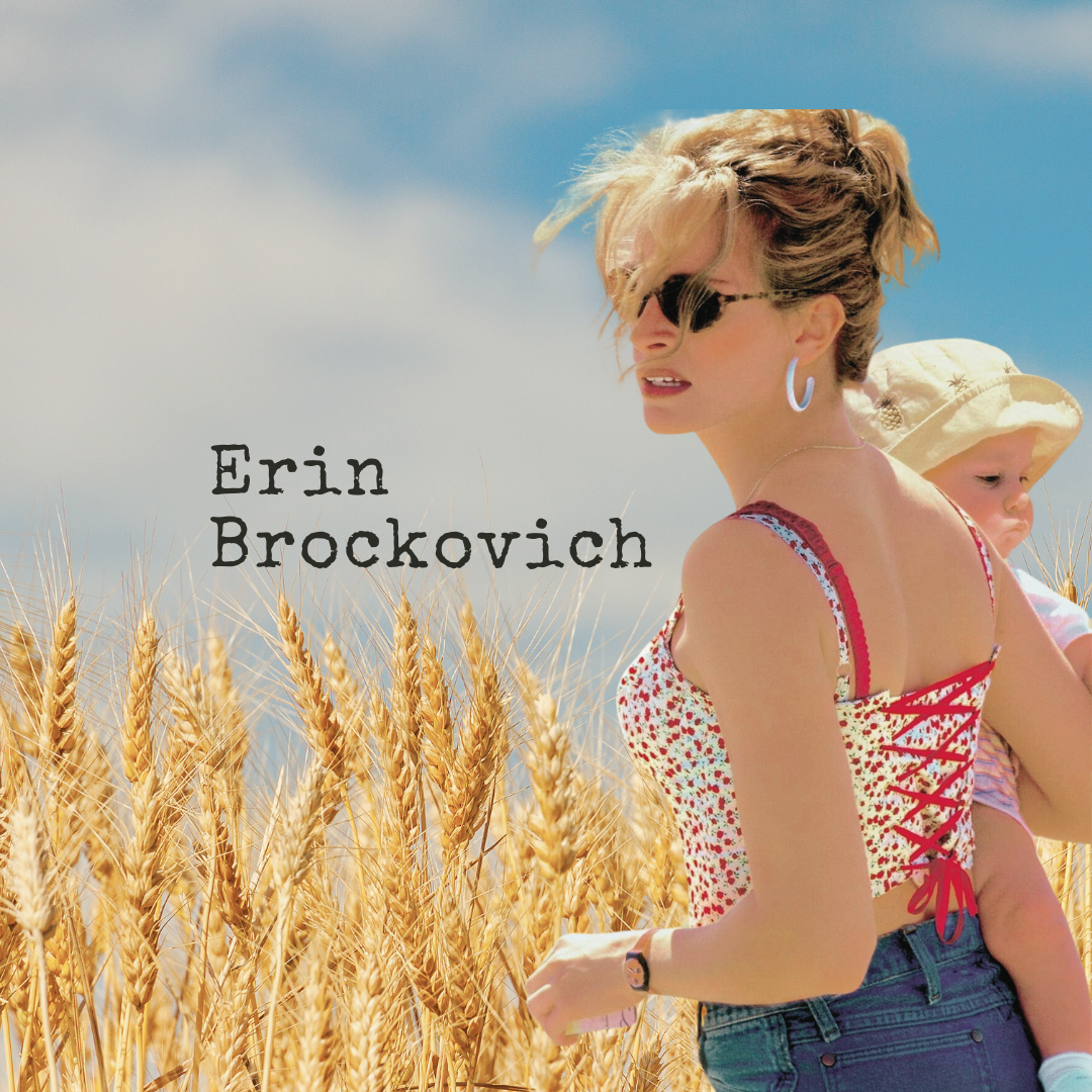 Erin Brockovich in field holding baby
